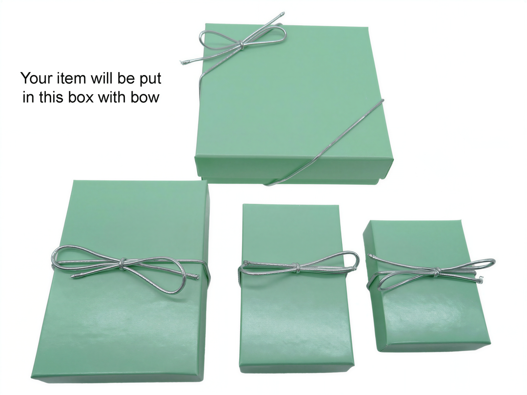 a collection of green gift boxes tied with silver ribbons, with instructions indicating that the item will be placed in one of these boxes with a bow.