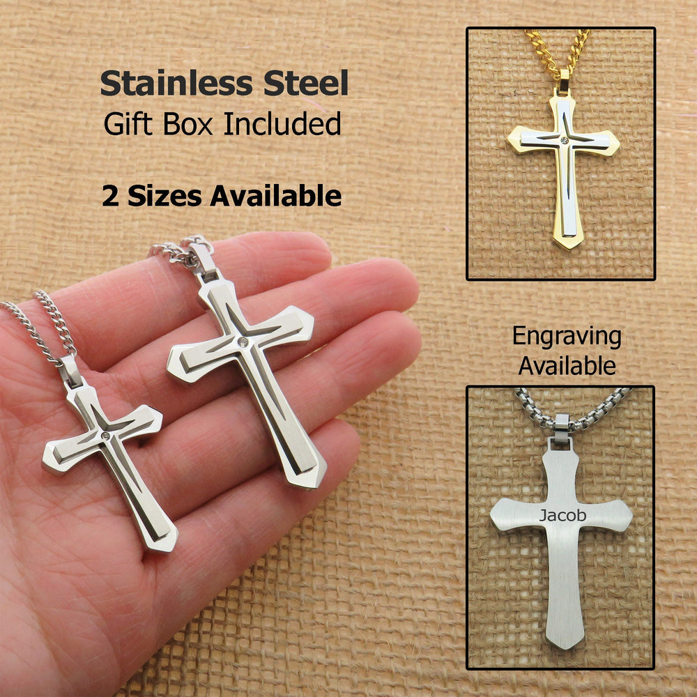 a hand holding a stainless steel cross pendant, with a gift box containing two sizes of crosses. The pendants are engraved with the names " Jacob" and " Jacob".