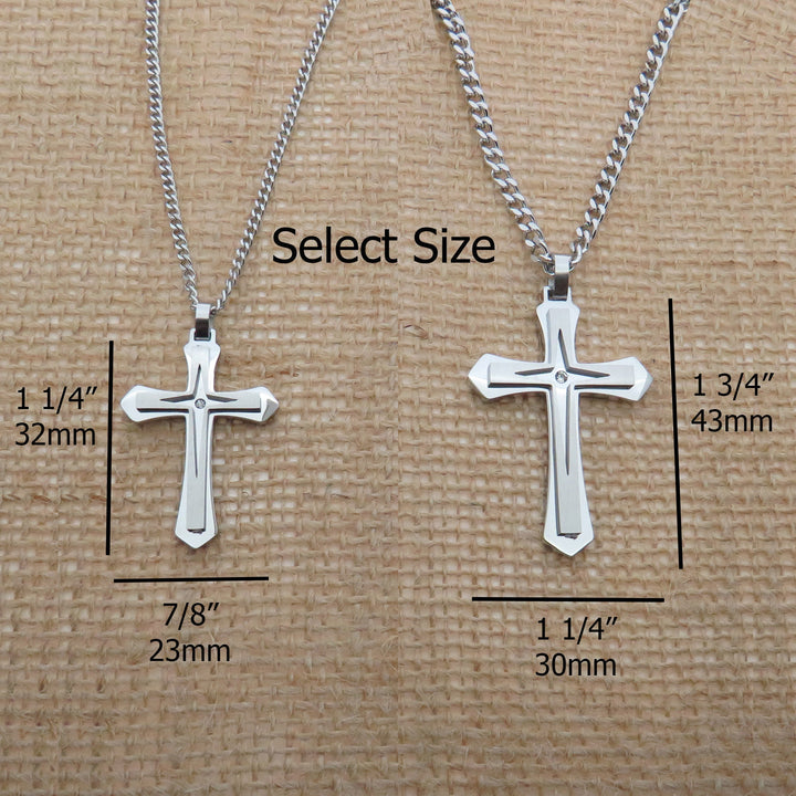 two silver cross necklaces with different sizes, each labeled with its corresponding size in millimeters.