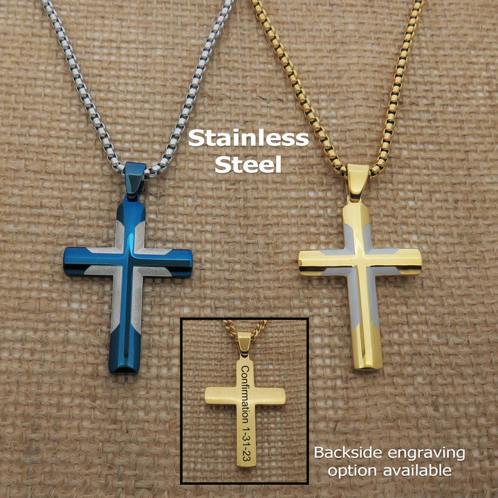 two stainless steel cross necklaces, one in blue and one in gold, with the text "Stainless Steel" and "Confirmation 1-3-23" engraved on them.